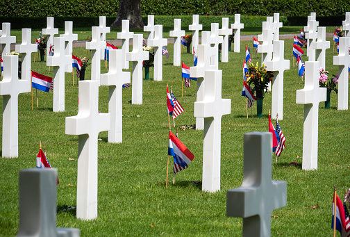 White crosses on the graves of American soldiers who died in World War II at the Netherlands American Cemetery and Memorial at Margraten in the Dutch province of Limburg. The Netherlands American Cemetery and Memorial is the only American military cemetery in the Netherlands. Every grave at Netherlands American Cemetery has been adopted by a local citizen.