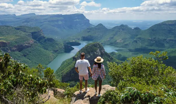 Panorama Route South Africa, Blyde river canyon with the three rondavels, view of three rondavels and the Blyde river canyon in South Africa. Asian women and Caucasian men on vacation in South Africa