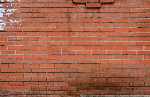 an old dirty brick wall. textured background of red brick