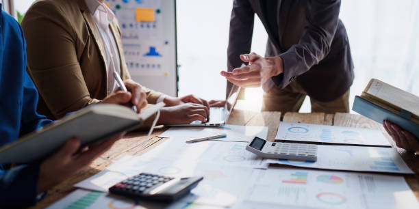 istock Business team working with financial document at office. analysis, discussion and brainstorming, business strategy 1474982643