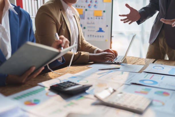 istock Business team working with financial document at office. analysis, discussion and brainstorming, business strategy 1474982706