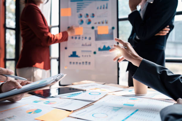 istock Business team working with financial document at office. analysis, discussion and brainstorming, business strategy 1474982918