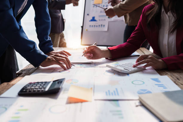 istock Business team working with financial document at office. analysis, discussion and brainstorming, business strategy 1474988527