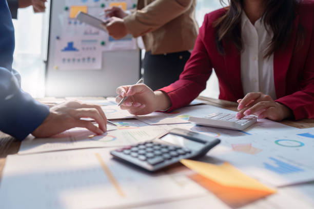 istock Business team working with financial document at office. analysis, discussion and brainstorming, business strategy 1474988575