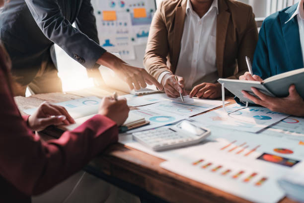 istock Business team working with financial document at office. analysis, discussion and brainstorming, business strategy 1474988892