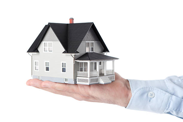 istock Hand holding household model, isolated 147498973