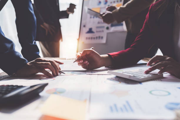 istock Business team working with financial document at office. analysis, discussion and brainstorming, business strategy 1474989802