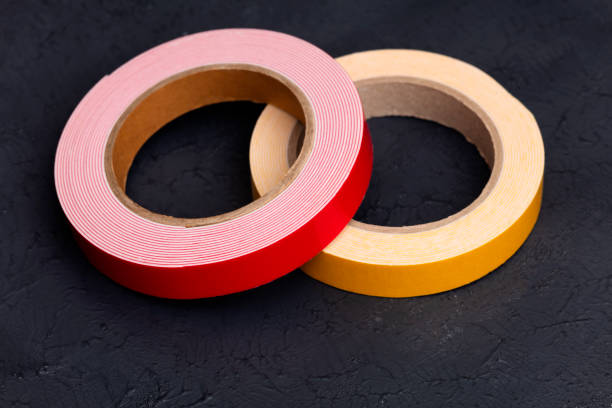 rote und gelbe objekte - duct tape adhesive tape clipping path adhesive bandage stock-fotos und bilder