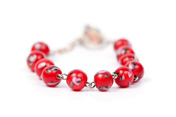 istock Bracelet with red beads isolated on white background 147499206