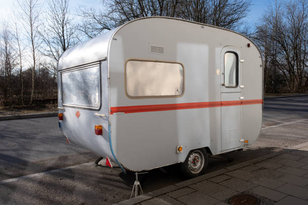 istock old little tiny camper trailer parked on the street 1474993782