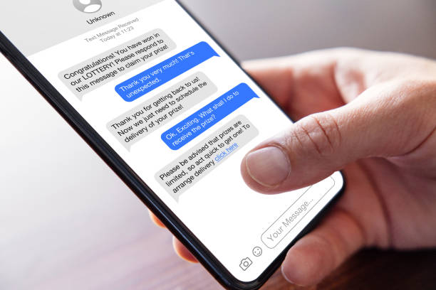 istock Person reading scam messages on mobile phone 1474993853