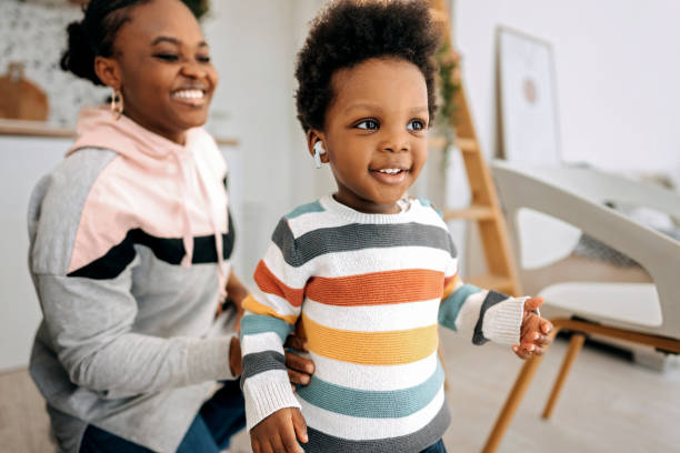 istock Toddler having fun with mother at home 1474994738