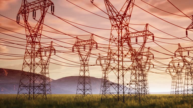 Drone footage of power lines at sunset. Power plant.