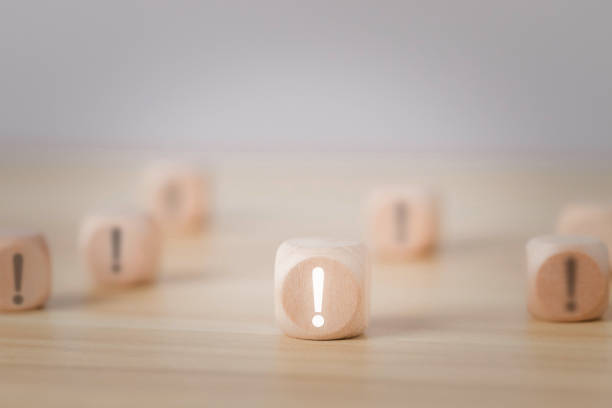 istock Exclamation mark written on wooden block Blocks set on white background 1474996479