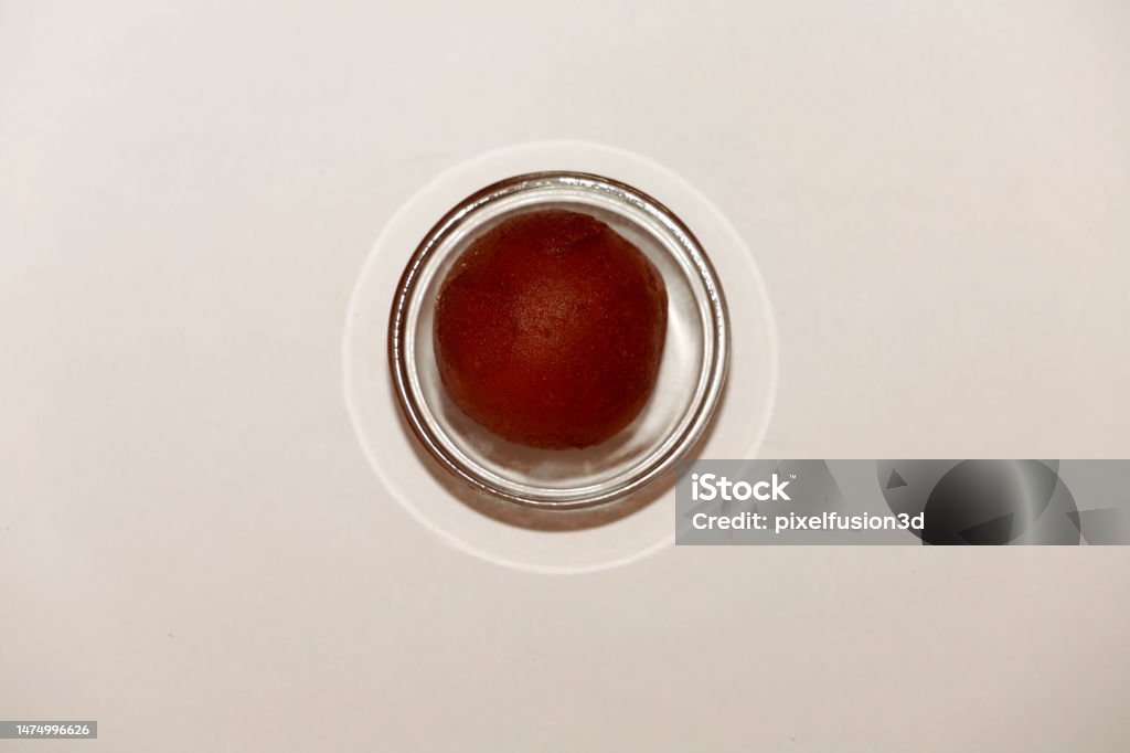 Gulab jamun in glass bowl Indian sweet Gulab jamun in glass bowl isolated on white background. Bowl Stock Photo