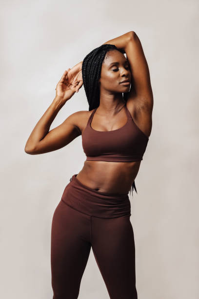 istock woman stretching arm with eyes closed 1474998081
