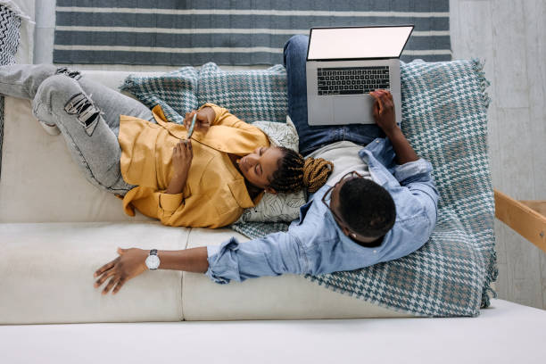 istock Couple relaxing at home 1474998492