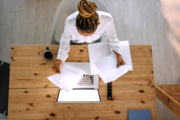 istock Female entrepreneur working on a laptop in her home office 1474998593