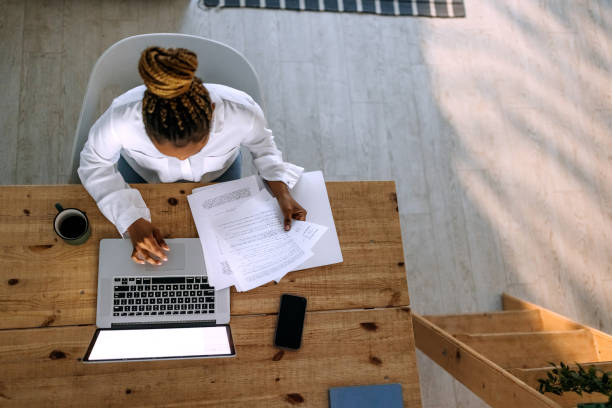 istock Female entrepreneur working on a laptop in her home office 1474998631