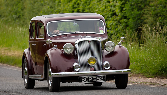 Erquy, France - June 26, 2022: An old being old timer classic Citroen 2CV (Dodoche ) car in a very good shape. The Citroën 2CV (French deux chevaux \