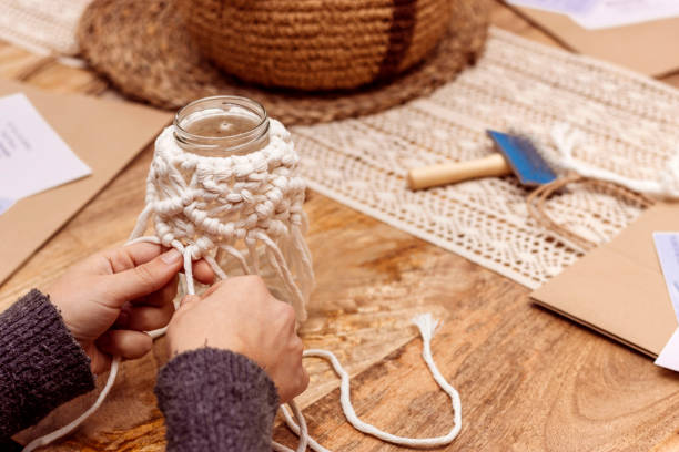 istock White macrame. Finishing macrame knots on a jar for decoration. 1475001852