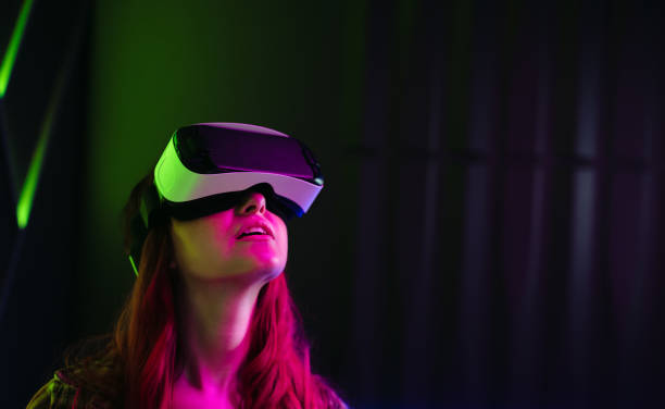 istock Virtual reality exploration: Young woman wearing a VR headset 1475002741