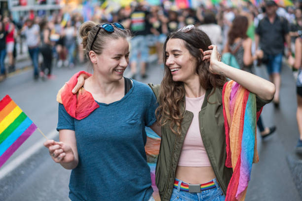 istock Two girls waving pride flag 1475005288