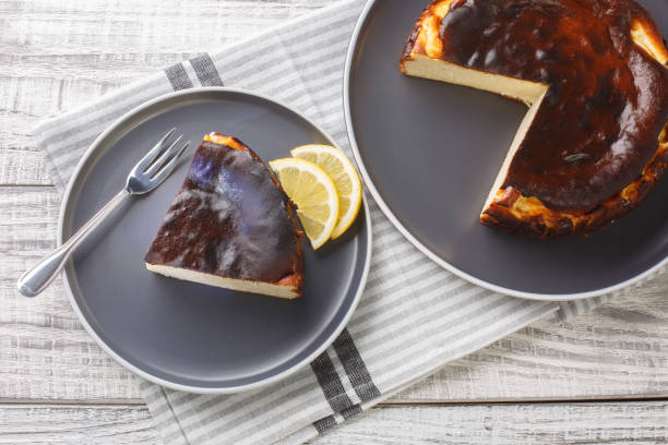 istock Basque cheesecake with a creamy center and a deeply caramelized crust top and bottom closeup on the plate. Horizontal top view 1475005657
