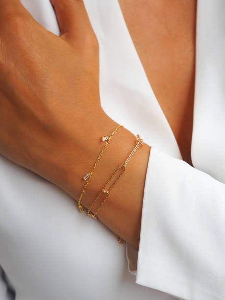 istock Gold diamond bracelet on a woman wrist 1475006661
