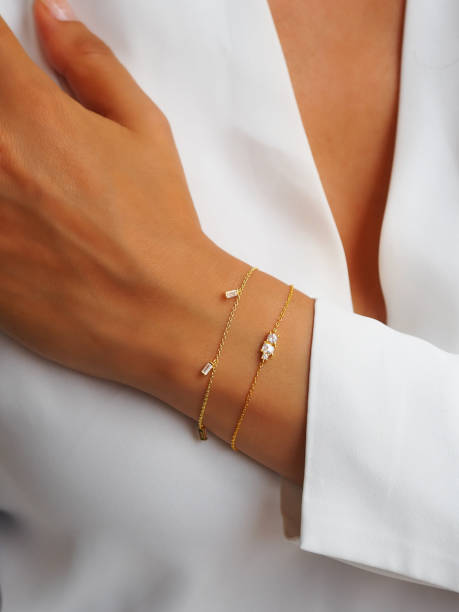 istock Gold diamond bracelet on a woman wrist 1475006662