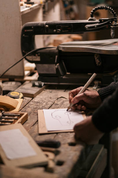 istock Drawing a sketch in a woodshop! 1475012706