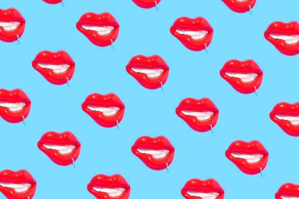 istock Seamless pattern made of sensual red lips with piercing ring on blue background. 1475013115