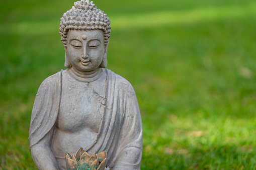 Statue of Buddha made of stone.