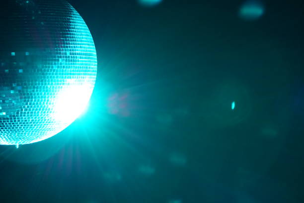 istock A disco ball (also known as a mirror ball or glitter ball) is a roughly spherical object that reflects light directed at it in many directions, producing a complex display. 1475015924