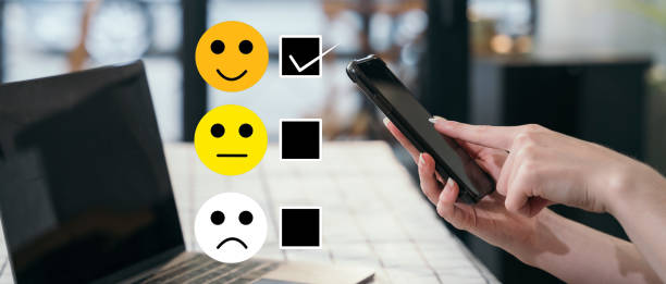 istock User give rating to service experience on online application smartphone. 1475016805