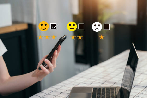 istock User give rating to service experience on online application smartphone. 1475016810