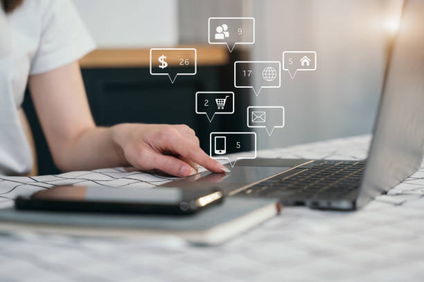 istock Hand women using smart phone and laptop, social media. 1475016821