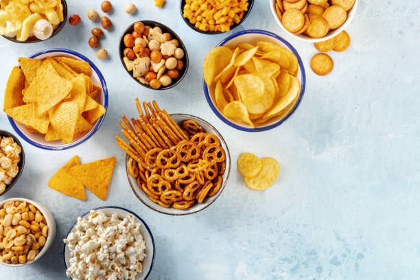istock Salty snacks, party mix, shot from the top with copy space. An assortment 1475018778