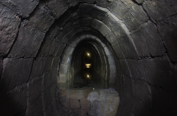 istock Old underground cave tunnel filled with water 1475022857