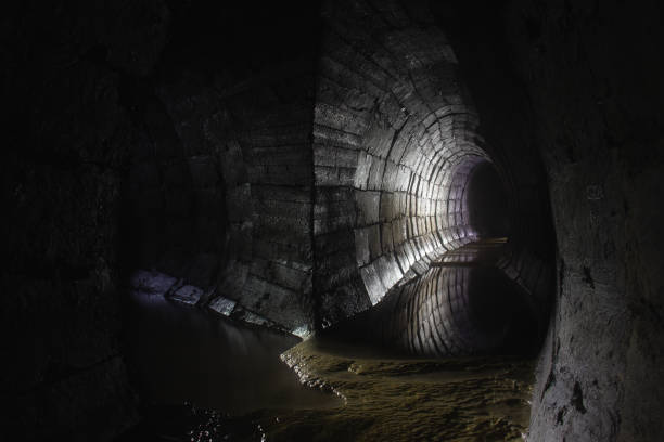 istock Old underground cave tunnel filled with water 1475022858