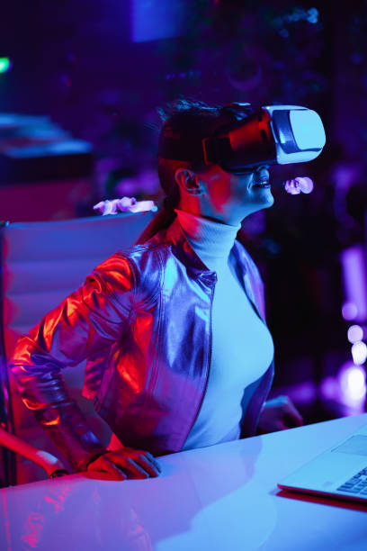 istock curious female in virtual reality goggles in office 1475023858