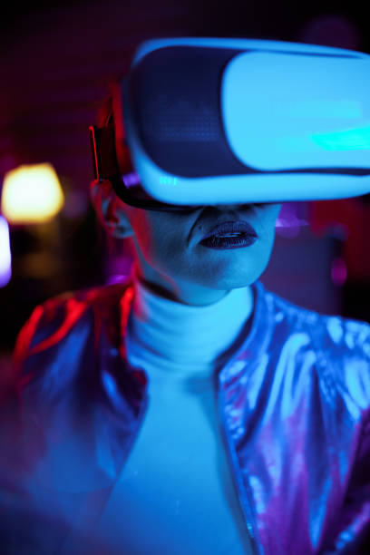 istock stylish woman in vr headset on dark background 1475023872