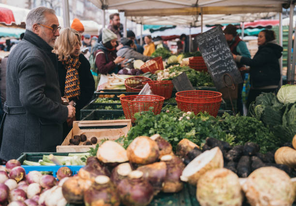 Rennes,Bretagne,France, March 11 2023: Locals and tourists walking around and shopping for local products at Lices market at Lices square on a Saturday Morning. Lices market is one of the biggest food market in France, which only takes place on every Saturday on Lices square in Rennes.