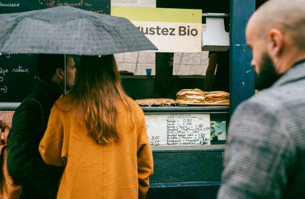 Rennes,Bretagne,France, March 11 2023: Locals and tourists walking around and shopping for local products at Lices market at Lices square on a Saturday Morning. Lices market is one of the biggest food market in France, which only takes place on every Saturday on Lices square in Rennes.