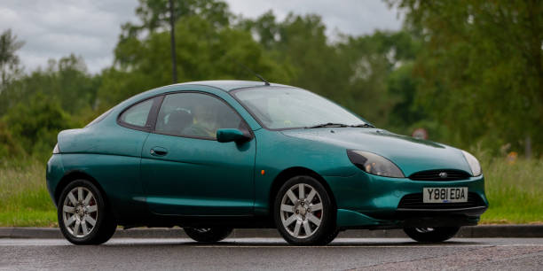 Ford Puma Stony Stratford, Bucks, UK. June 5th 2022. 2001 green 1679 cc Ford Puma on a rainy day 2001 stock pictures, royalty-free photos & images