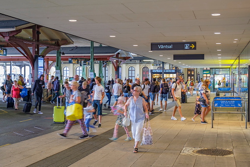 Gothenburg, Sweden-July, 2019: Railway station with people in a hurry in rush hour