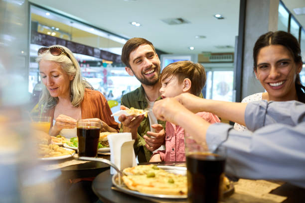 istock Happy multi-generation family having lunch at mall 1475032398
