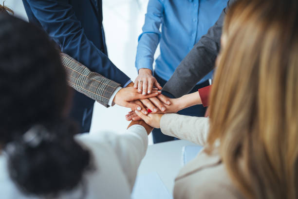 istock Stack of hands of men and woman. 1475034196