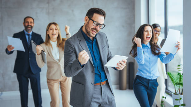 istock Shot of office staff celebrating a win. 1475034375