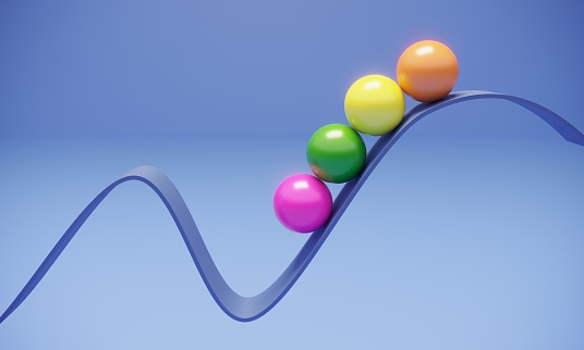 Multi colored balls standing on top of the blue wavy rising ribbon on blue background, can be used in balance, career growth, teamwork etc. concepts. (3d render)